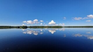 Sea and blue sky with white clouds.