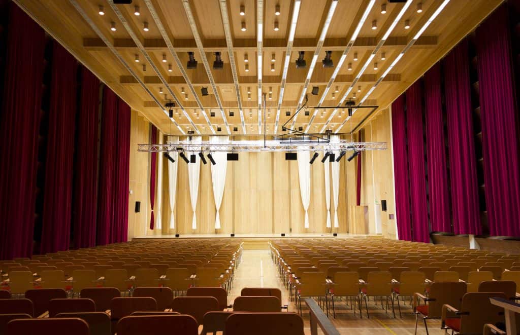 picture from behind the rows of benches towards the performance stage