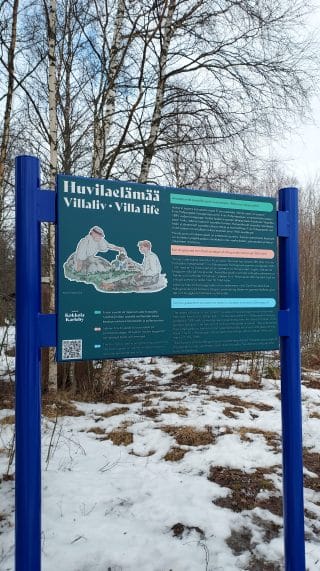 Green nature trail sign on Isokari Island. Sign tells about villa life.